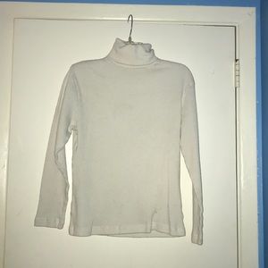 Carolyn Taylor white turtle neck